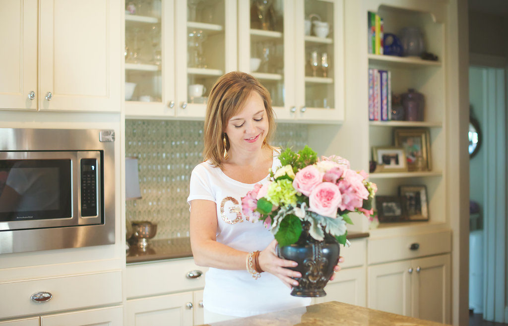 Marquette readies a kitchen for a photo shoot with one of her floral designs.  |  Photo by Dunlap Portrait 