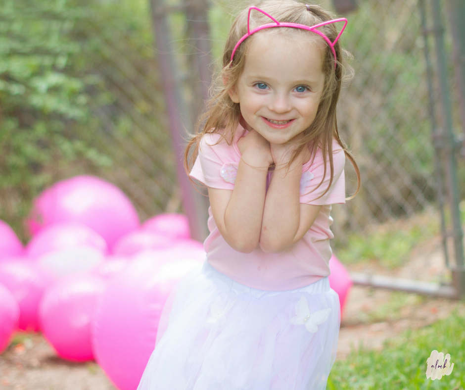 Beach balls strewn across the yard kept active children occupied and added a splash of color to the lawn. | A Life More Beautiful