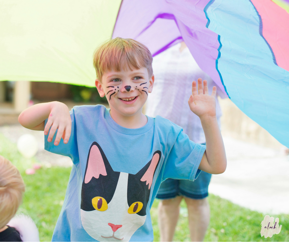 Playing under the parachute elicited a lot of giggles. | ALMB