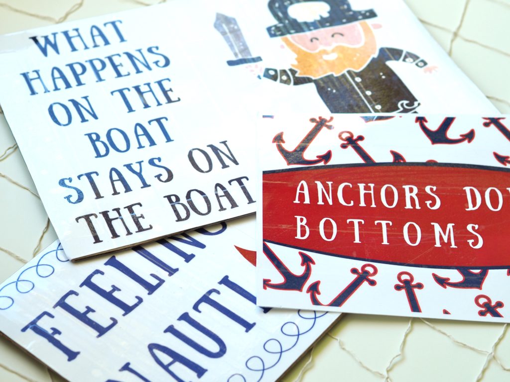 A Life More Beautiful designed photo props with festive nautical sayings.