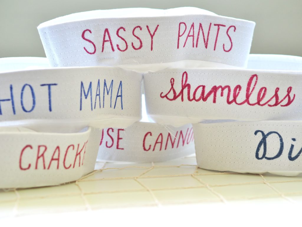 Sailor hats with saucy sayings were a fun photo prop and party favor | ALMB